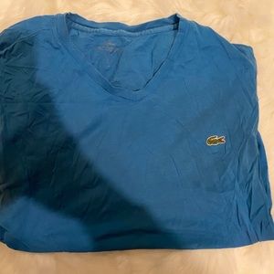 Blue worn lacoste shirt